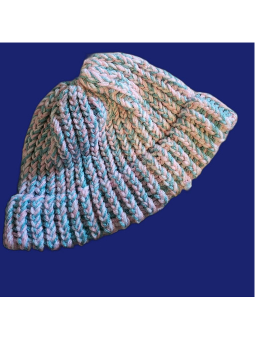 Handmade knitted beanie made using a loom hat making kit in pink and light blue